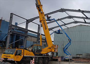 crane installing structural steel